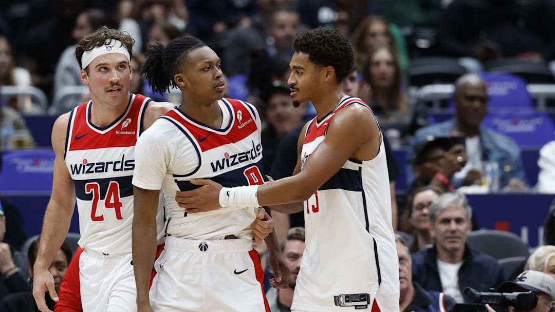 Oct 30, 2024; Washington, District of Columbia, USA; Washington Wizards guard Bub Carrington (8) is restrained by Wizards guard Jordan Poole (13) after being hard fouled by Atlanta Hawks guard Garrison Mathews (not pictured) in the first half at Capital One Arena. Mandatory Credit: Geoff Burke-Imagn Images Oct 30, 2024; Washington, District of Columbia, USA; Washington Wizards guard Bub Carrington (8) is restrained by Wizards guard Jordan Poole (13) after being hard fouled by Atlanta Hawks guard Garrison Mathews (not pictured) in the first half at Capital One Arena. Mandatory Credit: Geoff Burke-Imagn Images