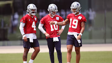 Jun 4, 2024; Frisco, TX, USA;  Dallas Cowboys quarterback Dak Prescott (4) and quarterback Cooper Rush (10) and quarterback Trey Lance (19) talk during practice at the Ford Center at the Star Training Facility in Frisco, Texas. Mandatory Credit: Tim Heitman-Imagn Images
