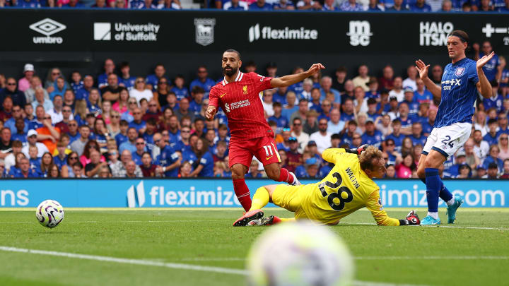 Mohamed Salah prods the ball past Christian Walton