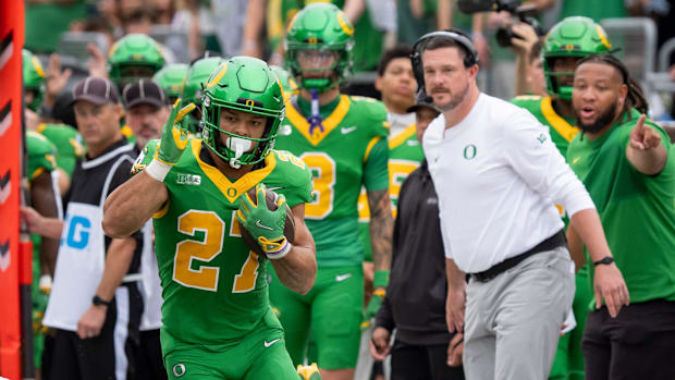 dan lanning oregon ducks northwestern wildcats oklahoma state cowboys dante moore quarterback running backs wide receiver