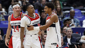 Oct 30, 2024; Washington, District of Columbia, USA; Washington Wizards guard Bub Carrington (8) is restrained by Wizards guard Jordan Poole (13) after being hard fouled by Atlanta Hawks guard Garrison Mathews (not pictured) in the first half at Capital One Arena. Mandatory Credit: Geoff Burke-Imagn Images