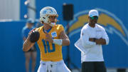 Jul 24, 2024; El Segundo, CA, USA;  Los Angeles Chargers quarterback Justin Herbert (10) throws during the first day of training camp at The Bolt. Mandatory Credit: Kiyoshi Mio-USA TODAY Sports