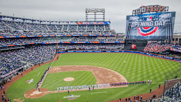 The scene at the Mets opening day. Mets fans and climate...