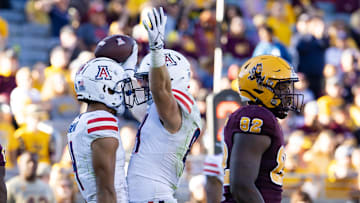 Nov 25, 2023; Tempe, Arizona, USA; Arizona Wildcats tight end Tanner McLachlan (right) celebrates a touchdown with wide receiver Tetairoa McMillan against the Arizona State Sun Devils in the second half of the Territorial Cup at Mountain America Stadium. Mandatory Credit: Mark J. Rebilas-Imagn Images