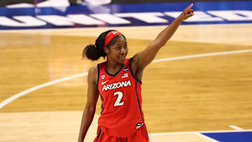 Apr 2, 2021; San Antonio, Texas, USA; Arizona Wildcats guard Aari McDonald (2) reacts while walking off the court after defeating the UConn Huskies in the national semifinals of the women's Final Four of the 2021 NCAA Tournament at Alamodome. Mandatory Credit: Troy Taormina-Imagn Images
