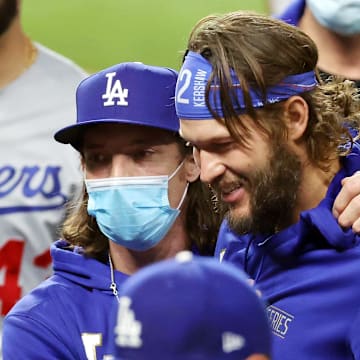 Los Angeles Dodgers game planning/communications coach Danny Lehmann (0) embraces starting pitcher Clayton Kershaw (22) after their win over the Tampa Bay Rays in Game 5 of the 2020 World Series at Globe Life Field on Oct. 25, 2020.