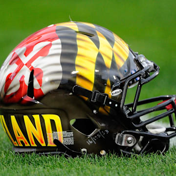 A Maryland football helmet sits on a field in 2014.