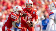 Nebraska quarterback Dylan Raiola fakes a handoff to running back Emmett Johnson against Houston Christian.