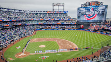 The scene at the Mets opening day. Mets fans and climate...