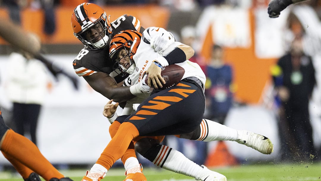 Oct 31, 2022; Cleveland, Ohio, USA; Cleveland Browns defensive end Isaiah Thomas (58) sacks Cincinnati Bengals quarterback Joe Burrow (9) during the second quarter at FirstEnergy Stadium. Oct 31, 2022; Cleveland, Ohio, USA; Cleveland Browns defensive end Isaiah Thomas (58) sacks Cincinnati Bengals quarterback Joe Burrow (9) during the second quarter at FirstEnergy Stadium.