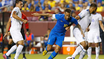 Sep 11, 2018; Landover, MD, USA; Brazil forward Neymar (10) dribbles the ball past El Salvador midfielder Arturo   lvarez (12) during an international friendly soccer match at FedEx Field. Mandatory Credit: Geoff Burke-Imagn Images