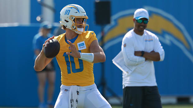 Jul 24, 2024; El Segundo, CA, USA;  Los Angeles Chargers quarterback Justin Herbert (10) throws during the first day of train