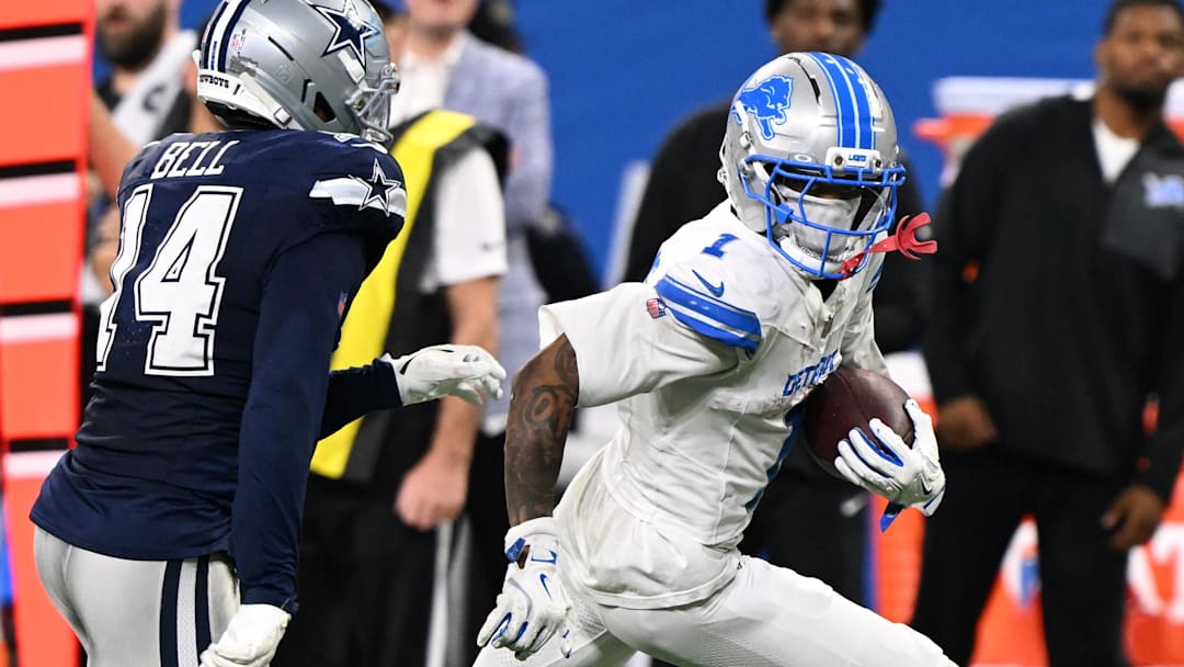 Detroit Lions wide receiver Jameson Williams (1) runs against Dallas Cowboys safety Markquese Bell (14) 