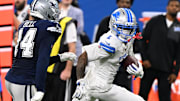 Detroit Lions wide receiver Jameson Williams (1) runs against Dallas Cowboys safety Markquese Bell (14) 