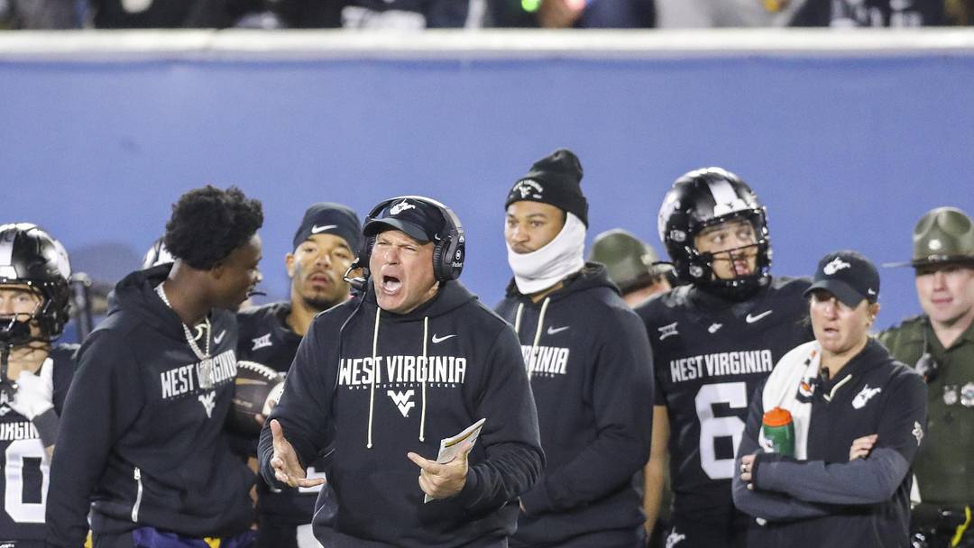 Oct 25, 2025; Morgantown, West Virginia, USA; West Virginia Mountaineers head coach Rich Rodriguez yells from the sideline late in the second quarter against the Texas Christian University Horned Frogs at Milan Puskar Stadium. Mandatory Credit: Ben Queen-Imagn Images