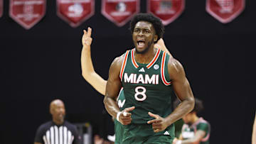 Nov 28, 2025; Kissimmee, FL, USA; Miami (FL) Hurricanes center Ernest Udeh Jr. (8) reacts after a basket against the Georgetown Hoyas in the first half during the ESPN Events Invitational at State Farm Field House. Mandatory Credit: Nathan Ray Seebeck-Imagn Images
