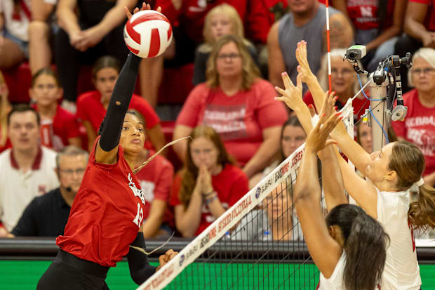 Nebraska outside hitter Taylor Landfair spikes the ball during the Red-White Scrimmage on Saturday.