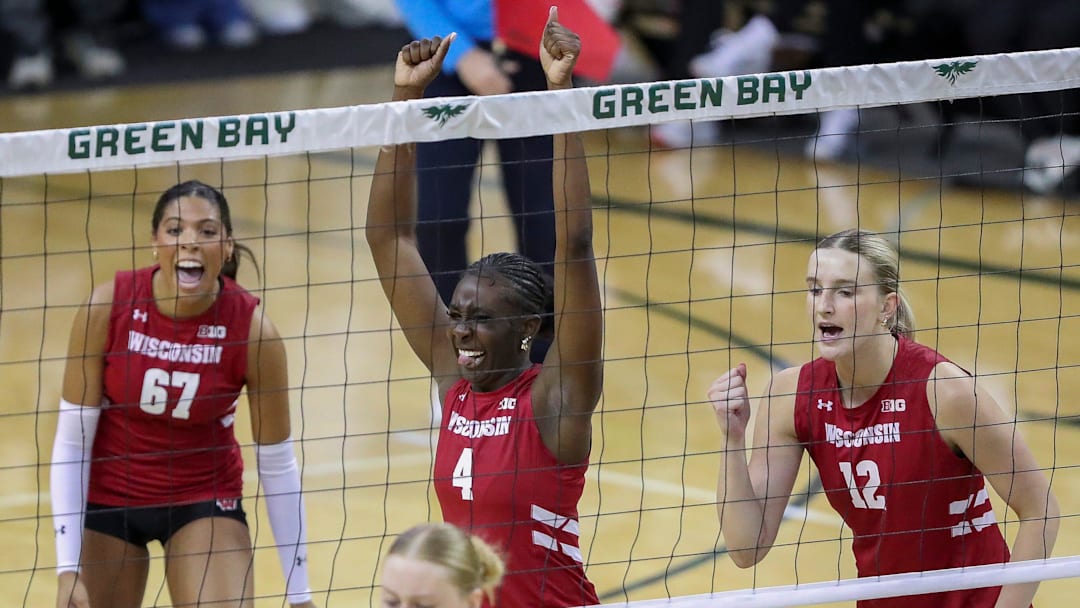 Wisconsin's Jaela Auguste (4) and Natalie Wardlow (12) react after winning a point against Wisconsin-Green Bay during an exhibition match on Saturday, April 18, 2026, at the Kress Center in Green Bay, Wis. Wisconsin won all five sets of the match.
Tork Mason/USA TODAY NETWORK-Wisconsin