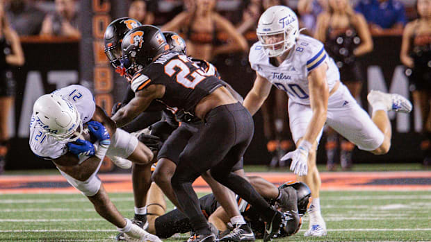 Tulsa Golden Hurricane running back Dominic Richardson (21) dives for yardage during the second half against OSU