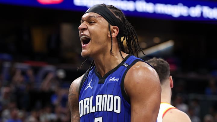 Apr 15, 2025; Orlando, Florida, USA;  Orlando Magic forward Paolo Banchero (5) reacts after a play against the Atlanta Hawks in the fourth quarter at Kia Center. Mandatory Credit: Nathan Ray Seebeck-Imagn Images