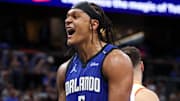 Apr 15, 2025; Orlando, Florida, USA;  Orlando Magic forward Paolo Banchero (5) reacts after a play against the Atlanta Hawks in the fourth quarter at Kia Center. Mandatory Credit: Nathan Ray Seebeck-Imagn Images