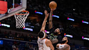 Dec 1, 2023; New Orleans, Louisiana, USA; New Orleans Pelicans forward Brandon Ingram (14) dunks the ball against San Antonio Spurs forward Zach Collins (23) during the first half at the Smoothie King Center.