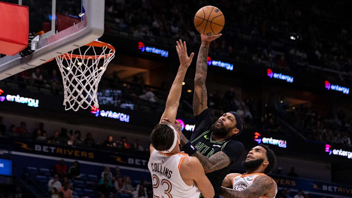 Dec 1, 2023; New Orleans, Louisiana, USA; New Orleans Pelicans forward Brandon Ingram (14) dunks the ball against San Antonio Spurs forward Zach Collins (23) during the first half at the Smoothie King Center.