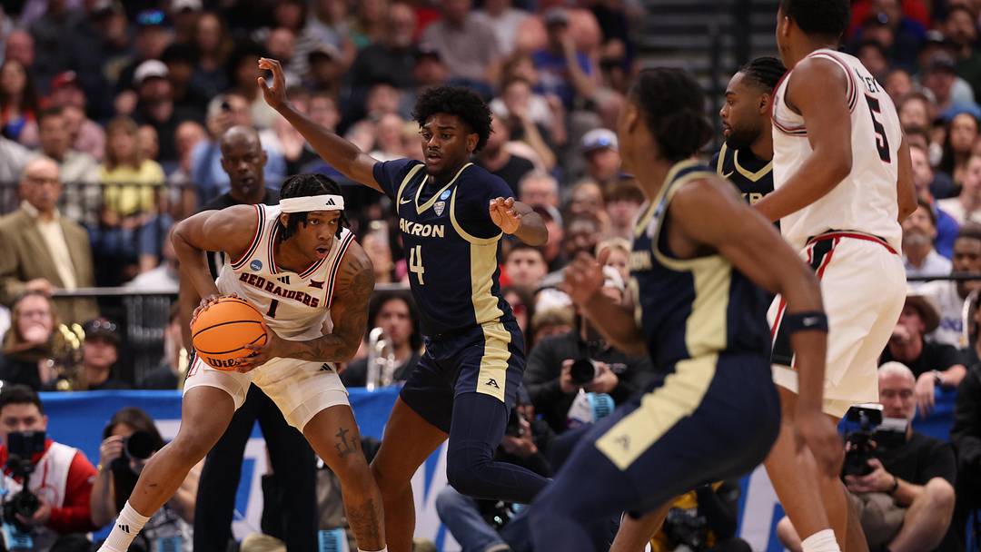 Mar 20, 2026; Tampa, FL, USA; Akron Zips guard Eric Mahaffey (4) defends Texas Tech Red Raiders guard Tyeree Bryan (1) in the second half during a first round game of the men's 2026 NCAA Tournament at Benchmark International Arena. Mandatory Credit: Matt Pendleton-Imagn Images