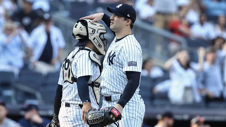 Sep 15, 2024; Bronx, New York, USA;  New York Yankees relief pitcher Tommy Kahnle (41) celebrates with catcher Jose Trevino (39) after defeating the Boston Red Sox 5-2 at Yankee Stadium. Mandatory Credit: Wendell Cruz-Imagn Images