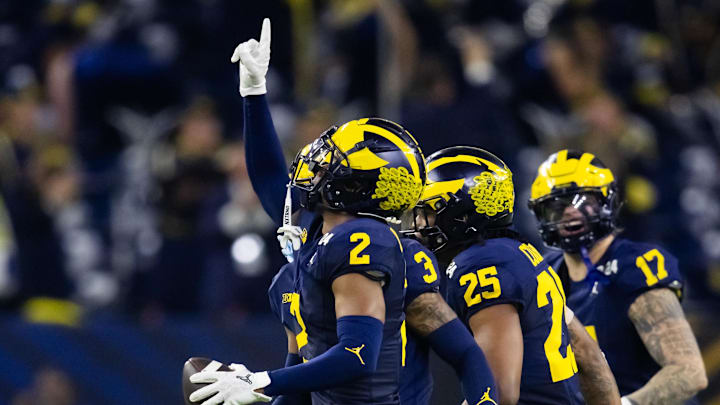 Jan 8, 2024; Houston, TX, USA; Michigan Wolverines defensive back Will Johnson (2) celebrates an interception against the Washington Huskies during the third quarter in the 2024 College Football Playoff national championship game at NRG Stadium. Mandatory Credit: Mark J. Rebilas-Imagn Images