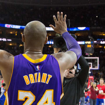 Dec 1, 2015; Philadelphia, PA, USA; Los Angeles Lakers forward Kobe Bryant (24) waves goodbye to fans at Wells Fargo Center after a game against the Philadelphia 76ers. The 76ers won 103-91. Mandatory Credit: Bill Streicher-USA TODAY Sports