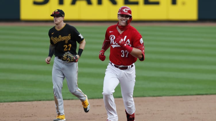 Cincinnati Reds pinch hitter Tyler Stephenson (37) reacts as he rounds the bases.