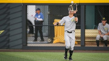 Oregon infielder Rikuu Nishida makes a catch in the outfield in the ninth inning during an NCAA college baseball tournament Super Regional game Saturday, June 10, 2023, in Eugene, Ore. Oral Roberts won 8-7.