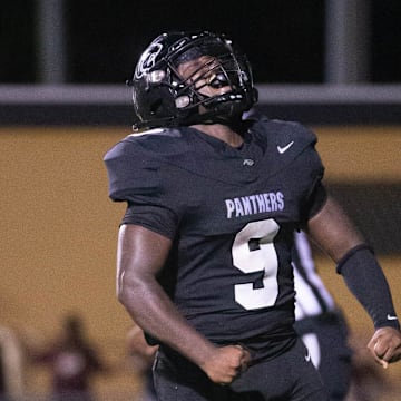 Kaedan Barnes (9) celebrates scoring a touchdown and taking a 6-0 Panthers lead during the Pensacola vs Milton football game at Milton High School on Thursday, Aug. 29, 2024.