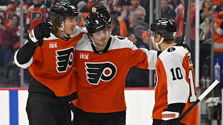Feb 3, 2026; Philadelphia, Pennsylvania, USA; Philadelphia Flyers defenseman Jamie Drysdale (9) celebrates his goal with center Trevor Zegras (46) and right wing Bobby Brink (10) against the Washington Capitals during the third period at Xfinity Mobile Arena. 
