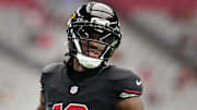 Arizona Cardinals receiver Marvin Harrison Jr. (18) warms up before their game against the Tennessee Titans at State Farm Stadium in Glendale on Oct. 5, 2025.