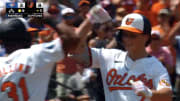 Baltimore Orioles second baseman Jackson Holliday celebrates a grand slam with center fielder Cedric Mullins.