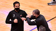 Jan 28, 2021; Miami, Florida, USA; Miami Heat head coach Erik Spoelstra elbow bumps LA Clippers head coach Tyronn Lue after the game at American Airlines Arena. Mandatory Credit: Jasen Vinlove-Imagn Images