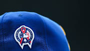 A patch remembering the September 11th terrorist attacks is seen on a Seattle Mariners hat during the game against the Atlanta Braves at T-Mobile Park in 2022.