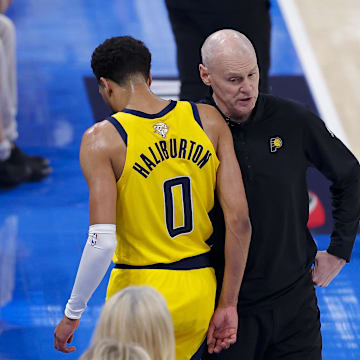 Jun 16, 2025; Oklahoma City, Oklahoma, USA; Indiana Pacers guard Tyrese Haliburton (0) comes off the floor past head coach Rick Carlisle in the first quarter against the Oklahoma City Thunder during game five of the 2025 NBA Finals at Paycom Center. Mandatory Credit: Alonzo Adams-Imagn Images