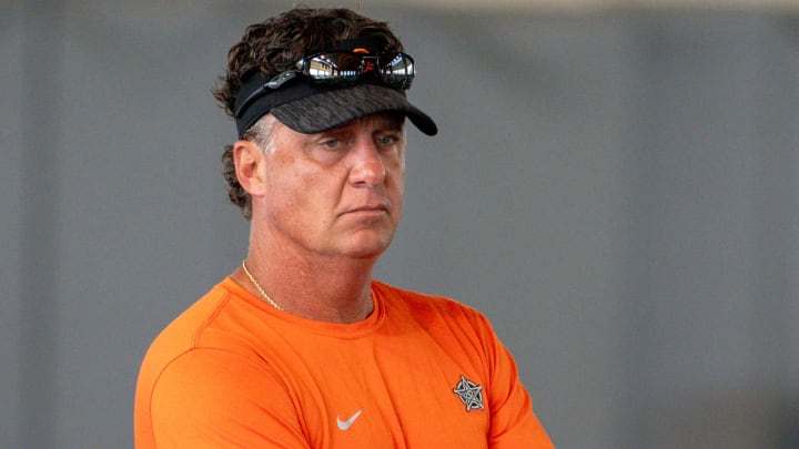 Head coach Mike Gundy walks on the field during an Oklahoma State football practice in Stillwater, Okla., on Saturday, Aug. 3, 2024.