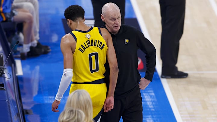 Jun 16, 2025; Oklahoma City, Oklahoma, USA; Indiana Pacers guard Tyrese Haliburton (0) comes off the floor past head coach Rick Carlisle in the first quarter against the Oklahoma City Thunder during game five of the 2025 NBA Finals at Paycom Center. Mandatory Credit: Alonzo Adams-Imagn Images