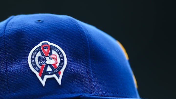 A patch remembering the September 11th terrorist attacks is seen on a Seattle Mariners hat during the game against the Atlanta Braves at T-Mobile Park in 2022.