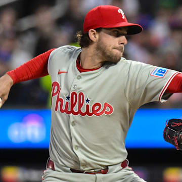 Apr 21, 2025; New York City, New York, USA; Philadelphia Phillies pitcher Aaron Nola (27) pitches against the New York Mets during the first inning at Citi Field. Mandatory Credit: John Jones-Imagn Images