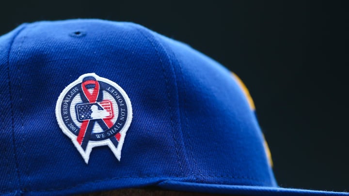 Sep 11, 2022; Seattle, Washington, USA;  A patch remembering the September 11th terrorist attacks is seen on a Seattle Mariners hat during the game against the Atlanta Braves at T-Mobile Park. Mandatory Credit: Lindsey Wasson-USA TODAY Sports