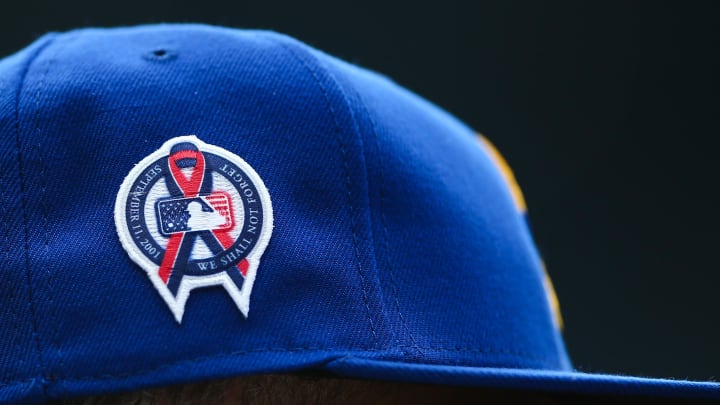 A patch remembering the September 11th terrorist attacks is seen on a Seattle Mariners hat during the game against the Atlanta Braves at T-Mobile Park in 2022.