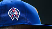 A patch remembering the September 11th terrorist attacks is seen on a Seattle Mariners hat during the game against the Atlanta Braves at T-Mobile Park in 2022.