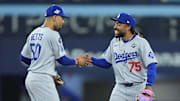 Oct 31, 2025; Toronto, Ontario, CAN; Los Angeles Dodgers shortstop Mookie Betts (50) and center fielder Justin Dean (75) celebrate after defeating the Toronto Blue Jays during game six of the 2025 MLB World Series at Rogers Centre. Mandatory Credit: John E. Sokolowski-Imagn Images