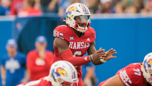 Kansas Jayhawks quarterback Jalon Daniels (6) waits for the snap behind the line during the first half against Wagner.