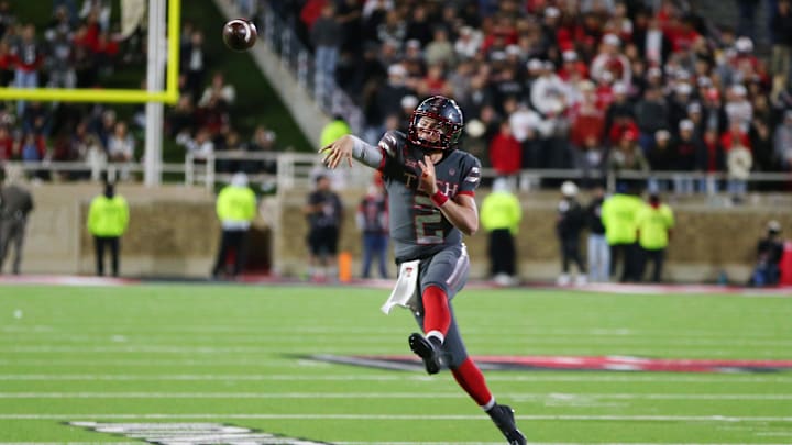 Nov 9, 2024; Lubbock, Texas, USA; Texas Tech Red Raiders quarterback Behren Morton (2) throws a pass in the second half against the Colorado Buffalos at Jones AT&T Stadium and Cody Campbell Field. Mandatory Credit: Michael C. Johnson-Imagn Images